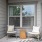 a couple of chairs outside a house