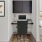 a room with a desk and a computer