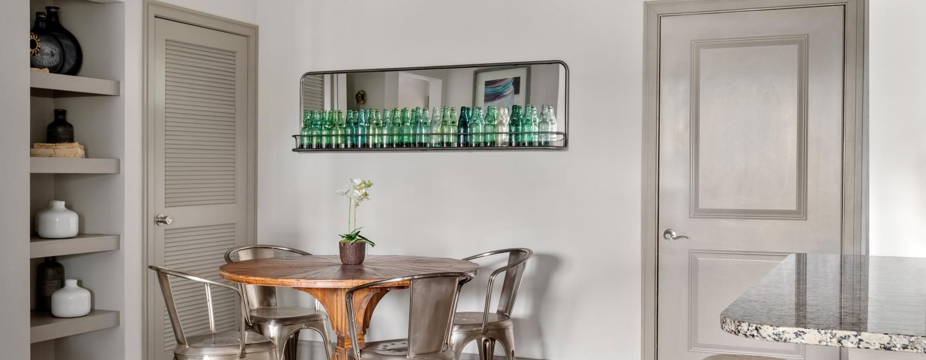 a dining room with a table and chairs