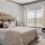 a bedroom with a bed and a chair