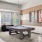 a room with a pool table and chairs